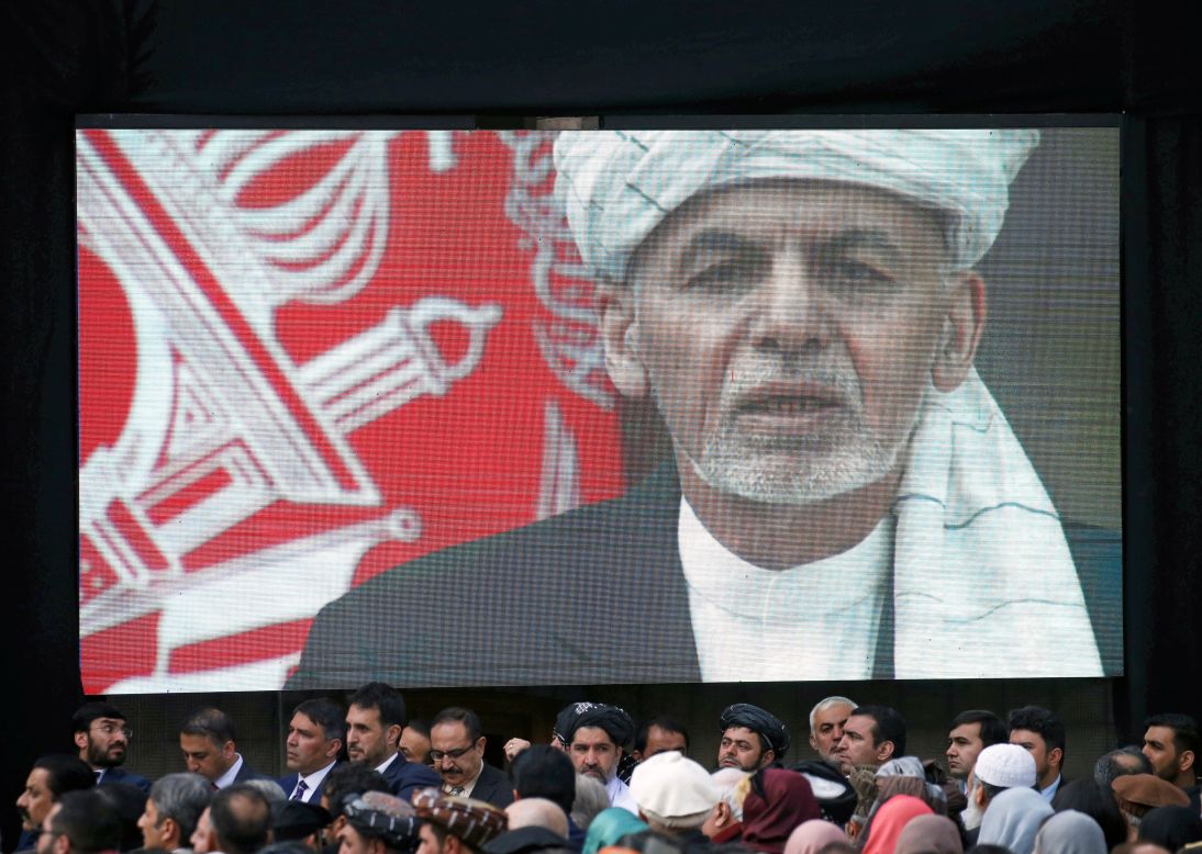 A screen shows Afghanistan President Ashraf Ghani during his inauguration on Monday, March 9.