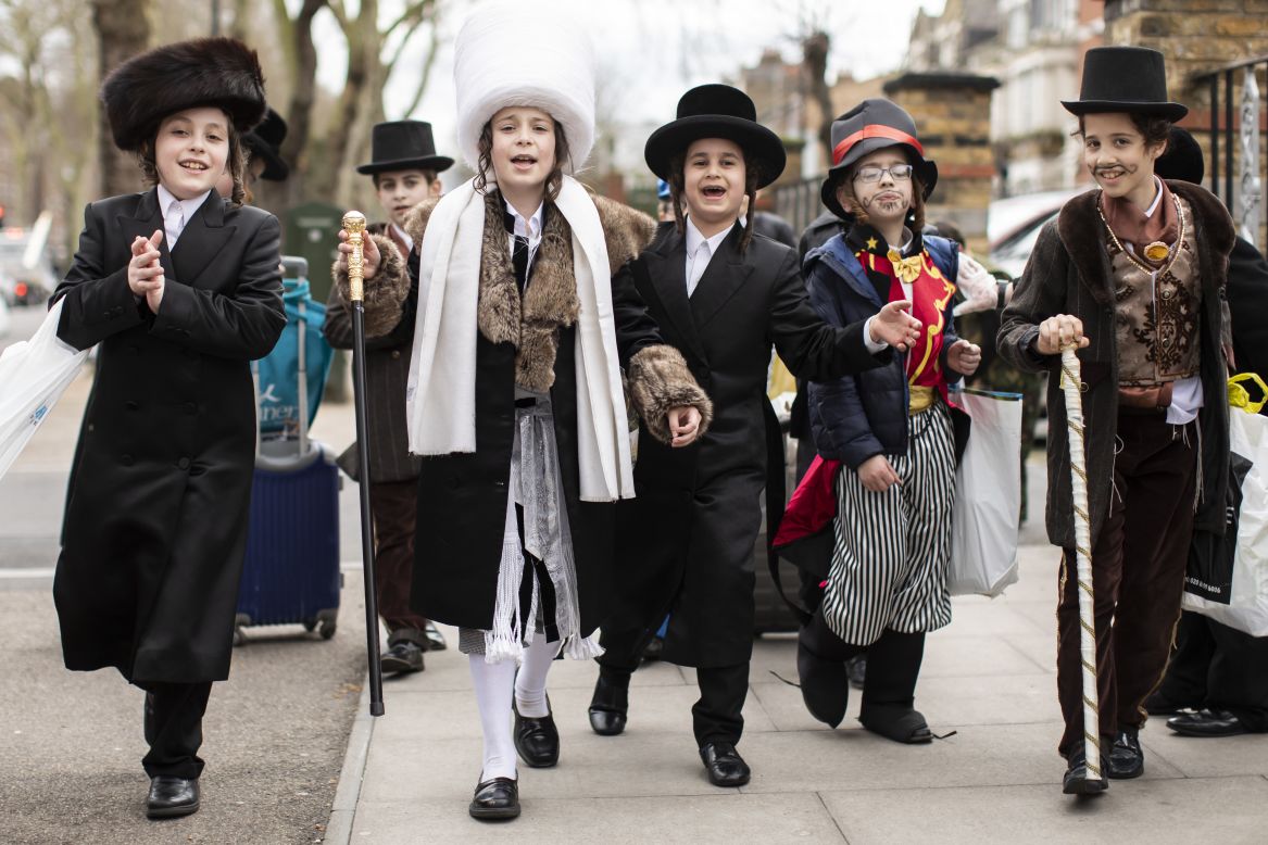 Children dance in a London street as they celebrate the Jewish holiday of Purim on Tuesday, March 10.