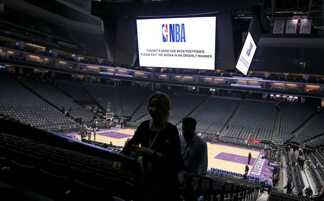 Fans leave the Golden 1 Center on Wednesday in California after the NBA basketball game between the New Orleans Pelicans and Sacramento Kings was postponed at the last minute.