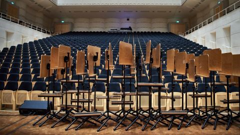 Music stands are placed in front of empty audience seats at the Konzerthaus in Dortmund, Germany, on March 12.