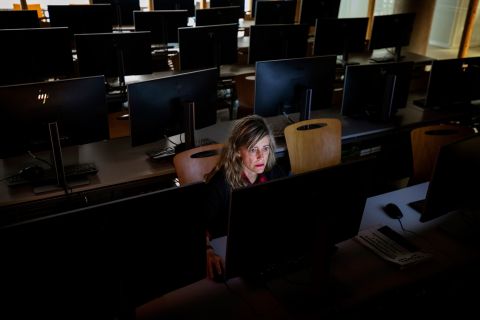 A teacher works in an empty classroom at the Pompeu Fabra University in Barcelona, Spain.