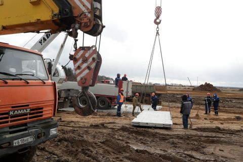 Workers prepare to construct an additional building on a hospital on the outskirts of Moscow.