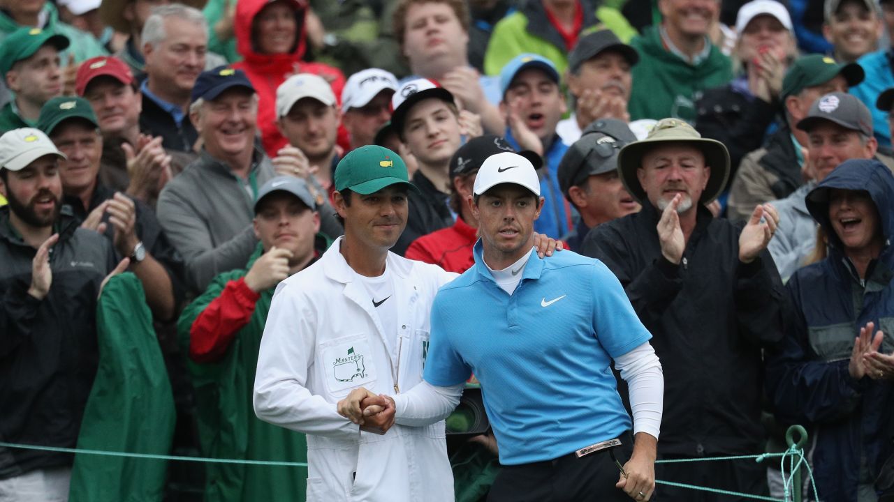 Rory McIlroy and caddie Harry Diamond shake hands on the 18th green during the third round of the 2018 Masters.