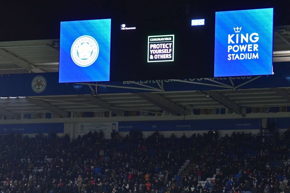 An advertisement warning people of the threat from the coronavirus is shown on the big screen at half-time during the English Premier League football match between Leicester City and Aston Villa.