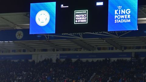 An advertisement warning people of the threat from the coronavirus is shown on the big screen at half-time during the English Premier League football match between Leicester City and Aston Villa.