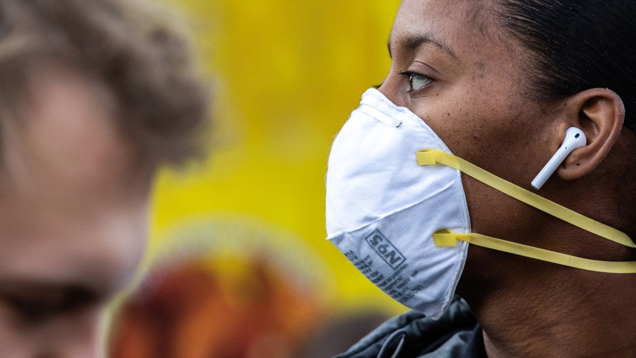 NEW YORK, NY - MARCH 09: A woman wearing a protective mask is seen in Union Square on March 9, 2020 in New York City. There are now 20 confirmed coronavirus cases in the city including a 7-year-old girl in the Bronx. (Photo by Jeenah Moon/Getty Images)