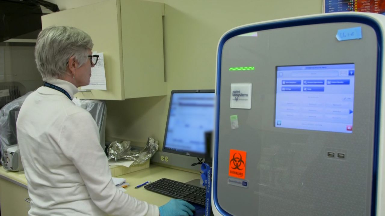 Doctors at University of Nebraska Medical Center analyze newly processed coronavirus lab test results.