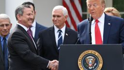 Brian Cornell, chairman and CEO of Target Corporation shakes hands with US President Donald Trump at a press conference on COVID-19, known as the coronavirus, in the Rose Garden of the White House in Washington, DC, March 13, 2020.
