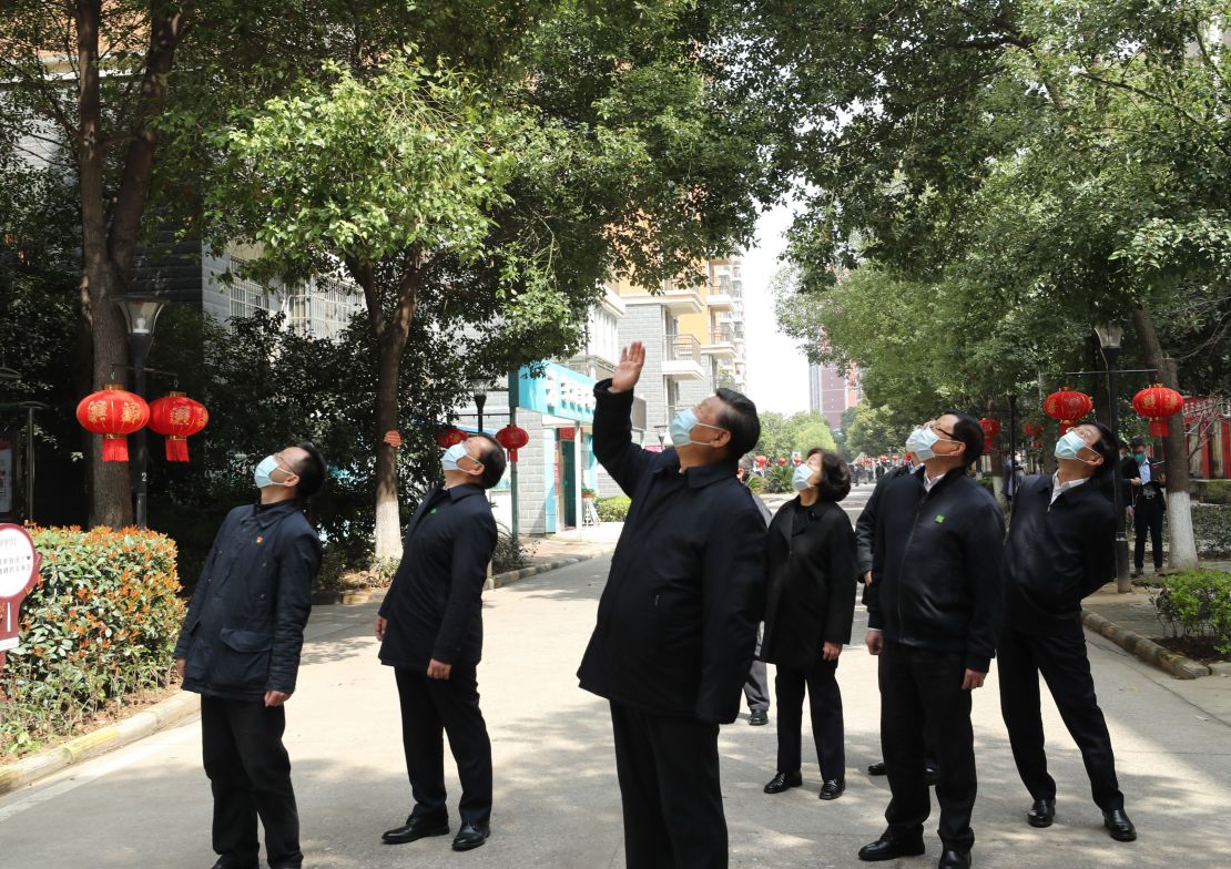 Chinese President Xi Jinping waved to residents quarantined at home in a residential community udring his tour of Wuhan, ground zero of the coronavirus pandemic.