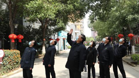 Chinese President Xi Jinping waved to residents quarantined at home in a residential community udring his tour of Wuhan, ground zero of the coronavirus pandemic.