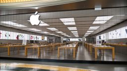 A closed Apple Store is pictured in a deserted EUROMA2 shopping mall in the E.U.R. district of Rome on March 12, 2020, as Italy shut all stores except for pharmacies and food shops in a desperate bid to halt the spread of a coronavirus that has killed 827 in the the country in just over two weeks. (Photo by ANDREAS SOLARO / AFP) (Photo by ANDREAS SOLARO/AFP via Getty Images)