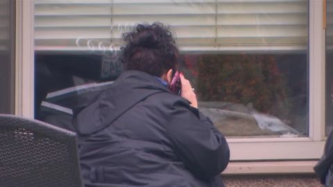 Families of patients in the nursing home communicate to them by phone, Skype and talking through the closed window.