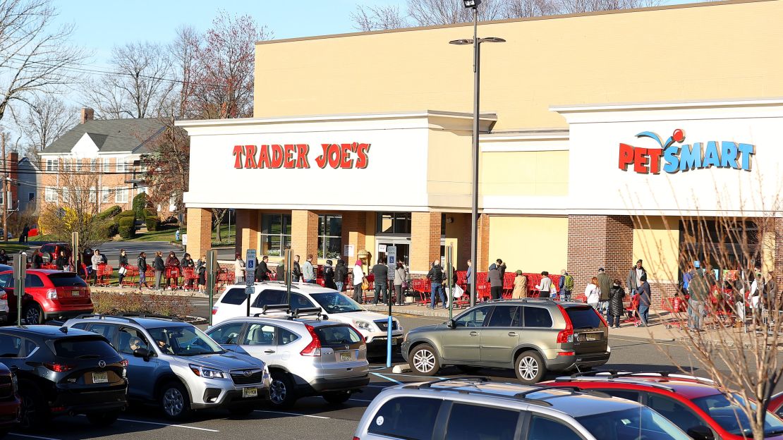 Long lines form outside a Trader Joes in Millburn, New Jersey, on March 14, 2020.