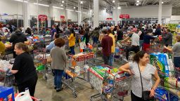 Shoppers line up with full carts in a supermarket in Virginia on March 13, 2020. - Earlier in the day US president Donald Trump declared coronavirus a national emergency. (Photo by Daniel SLIM / AFP) (Photo by DANIEL SLIM/AFP via Getty Images)