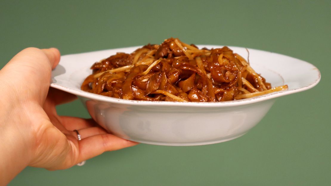 Fried beef ho fun, made with flat rice noodles. 