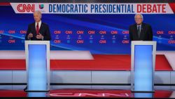 Former Vice President Joe Biden and Vermont Sen. Bernie Sanders participate in the Democratic debate in Washington, on Sunday, March 15.