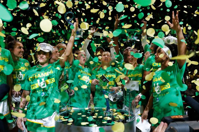 Oregon basketball players celebrate after they won the Pac-12 Tournament on Sunday, March 8.