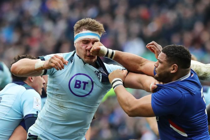 France's Mohamed Haouas punches Scotland's Jamie Ritchie during a Six Nations rugby match in Edinburgh, Scotland, on Sunday, March 8. Haouas received a red card and was sent off.