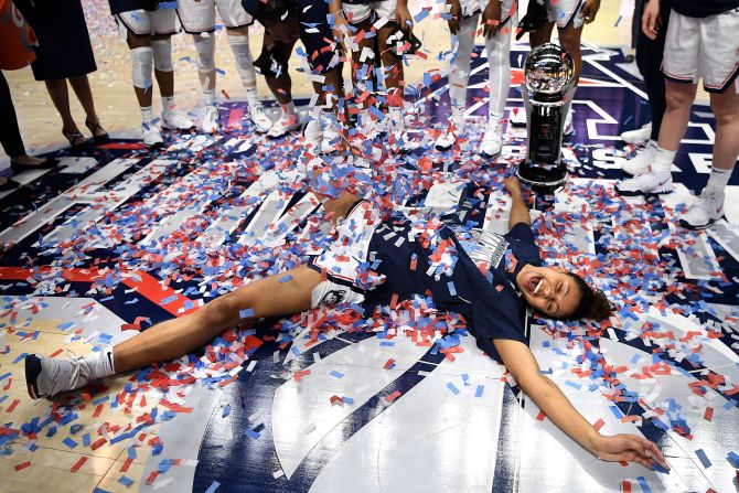 Connecticut's Olivia Nelson-Ododa makes a confetti angel after the Huskies won the American Athletic Conference's basketball tournament on Monday, March 9.
