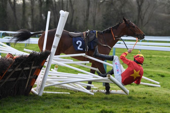 Marc Goldstein and Montys Angel rearrange the final hurdle during a fall in Fontwell, England, on Saturday, March 14.