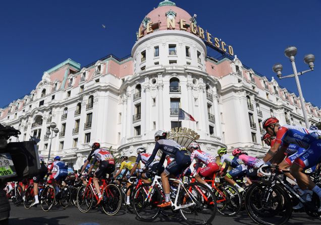 Cyclists ride in front of a hotel in Nice, France, during the Paris-Nice cycling race on Saturday, March 14.