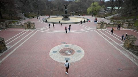 People enjoy the weather in Central Park on Saturday in New York.