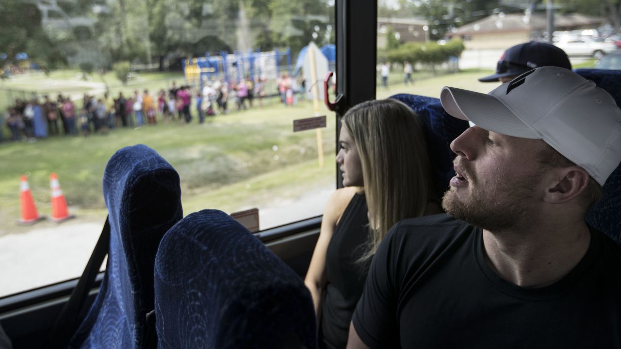 Watt and his 'JJ Watt Foundation' helped raise $41.6 million in the aftermath of Hurricane Harvey in 2017. Pictured is Watt and Ohai looking at the line of people waiting for distribution of relief supplies.