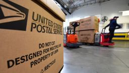 Loaded boxes of mail are transported to a container truck for delivery  inside one of the largest US Postal Service Package Processing and Distribution Centers for the Greater Los Angeles-area on December 12, 2019 in City of Industry, California, during the busiest time of the year for the Christmas season. (Photo by Frederic J. BROWN / AFP) (Photo by FREDERIC J. BROWN/AFP via Getty Images)