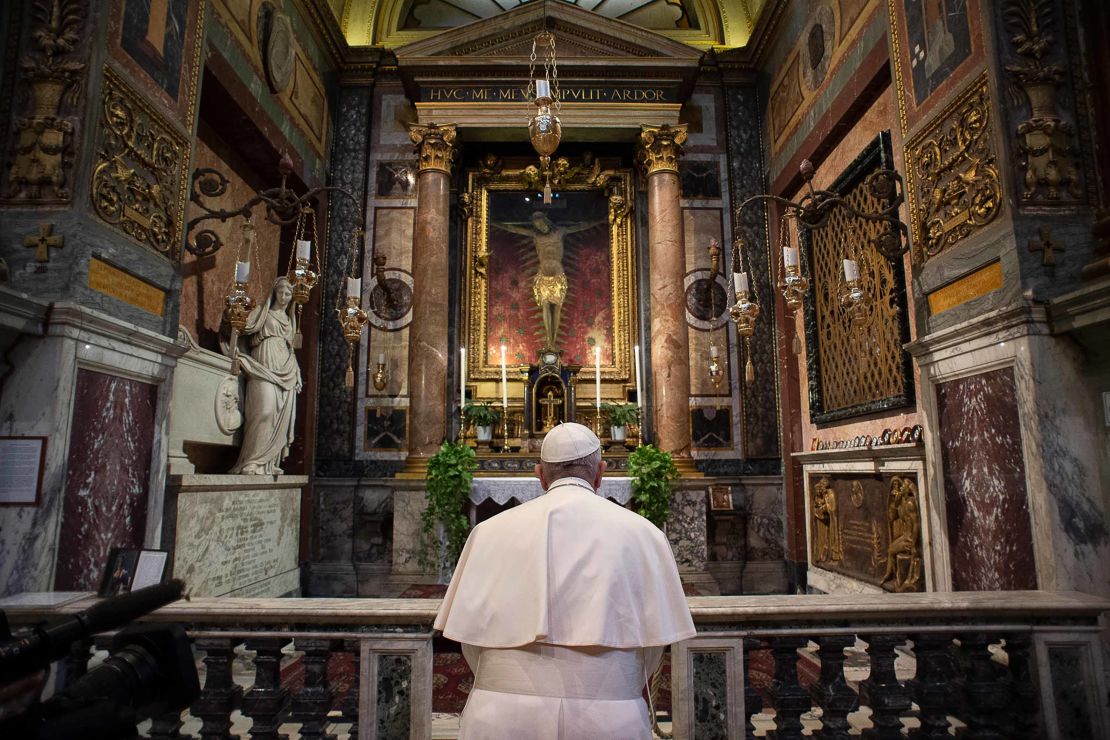 Pope Francis prays ast San Marcello al Corso church in Rome, home to a crucifix which believers say helped to end an outbreak of the plague in 1522.