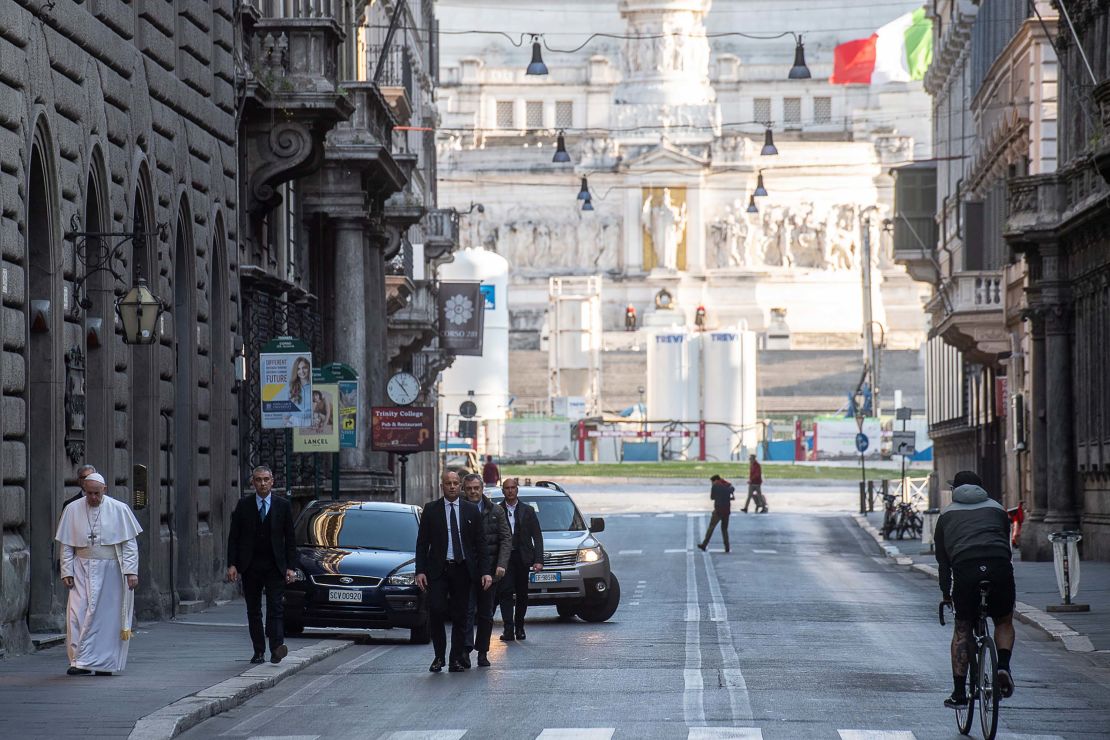 Pope Francis walks along the normally bustling Via del Corso in Rome on March 15, 2020. The street was almost empty because of Italy's strict coronavirus restrictions.