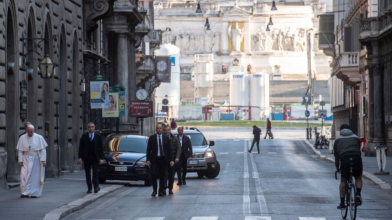 Pope Francis walks along the normally bustling Via del Corso in Rome on March 15, 2020. The street was almost empty because of Italy's strict coronavirus restrictions.