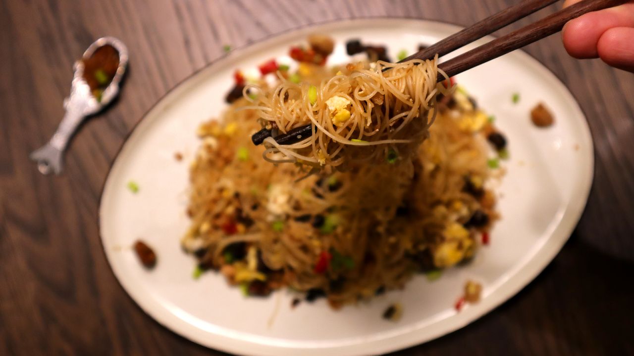 A plate of fried vermicelli. The noodles need to be soaked before they're cooked. 