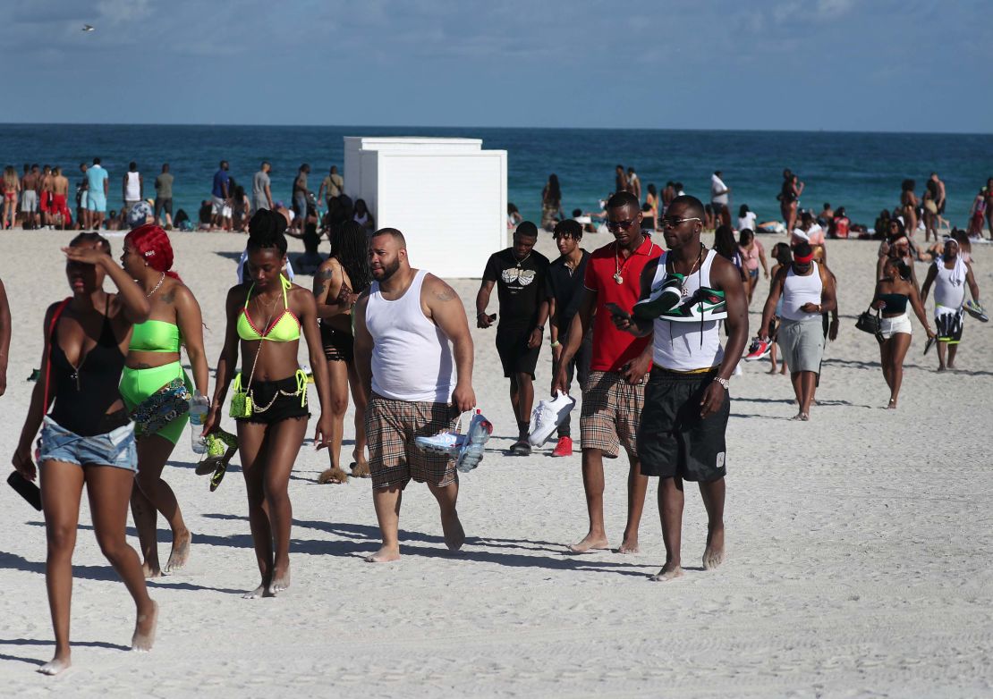 Beachgoers leave South Beach on Sunday.