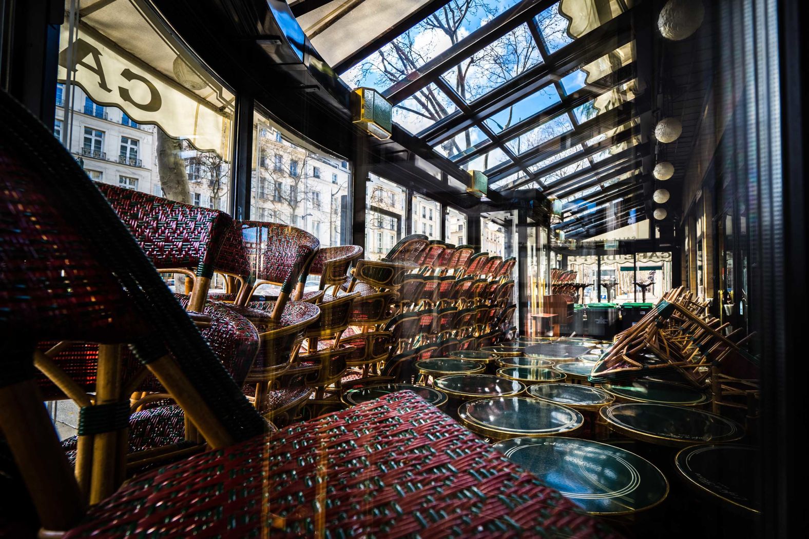 Stacked furniture is seen inside the closed Cafe de Flore in Paris on March 15.