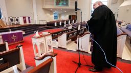 Rev. Kip Rush sets up a camera before a worship service at Brenthaven Cumberland Presbyterian Church Sunday, March 15, 2020, in Brentwood, Tenn. The church decided to broadcast the service instead of holding a service with the entire congregation because of the coronavirus. (AP Photo/Mark Humphrey)
