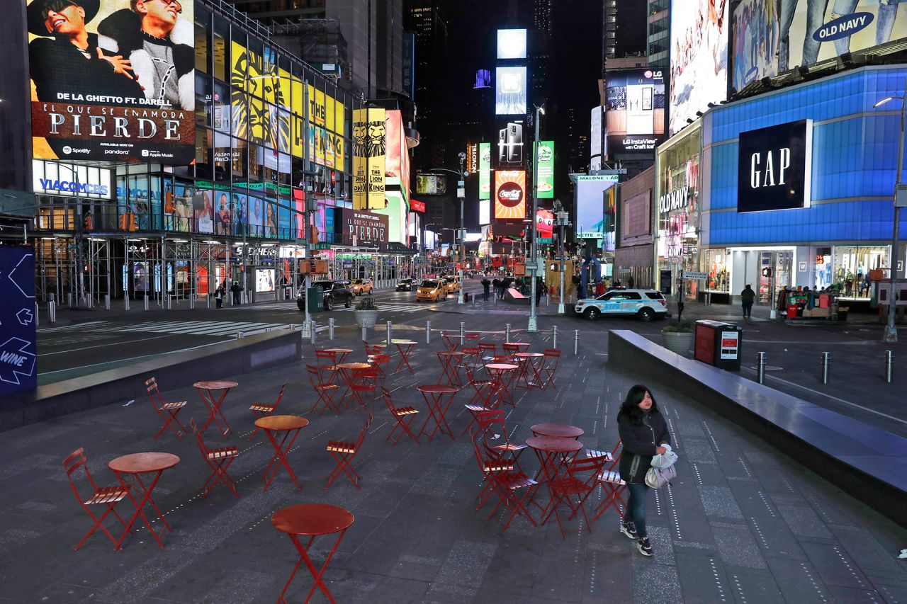 A woman in New York walks through a lightly trafficked Times Square on March 16.