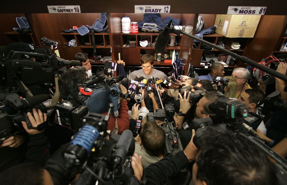 Brady is surrounded by the media in 2007. The Patriots went undefeated in the regular season but lost to the New York Giants in the Super Bowl.