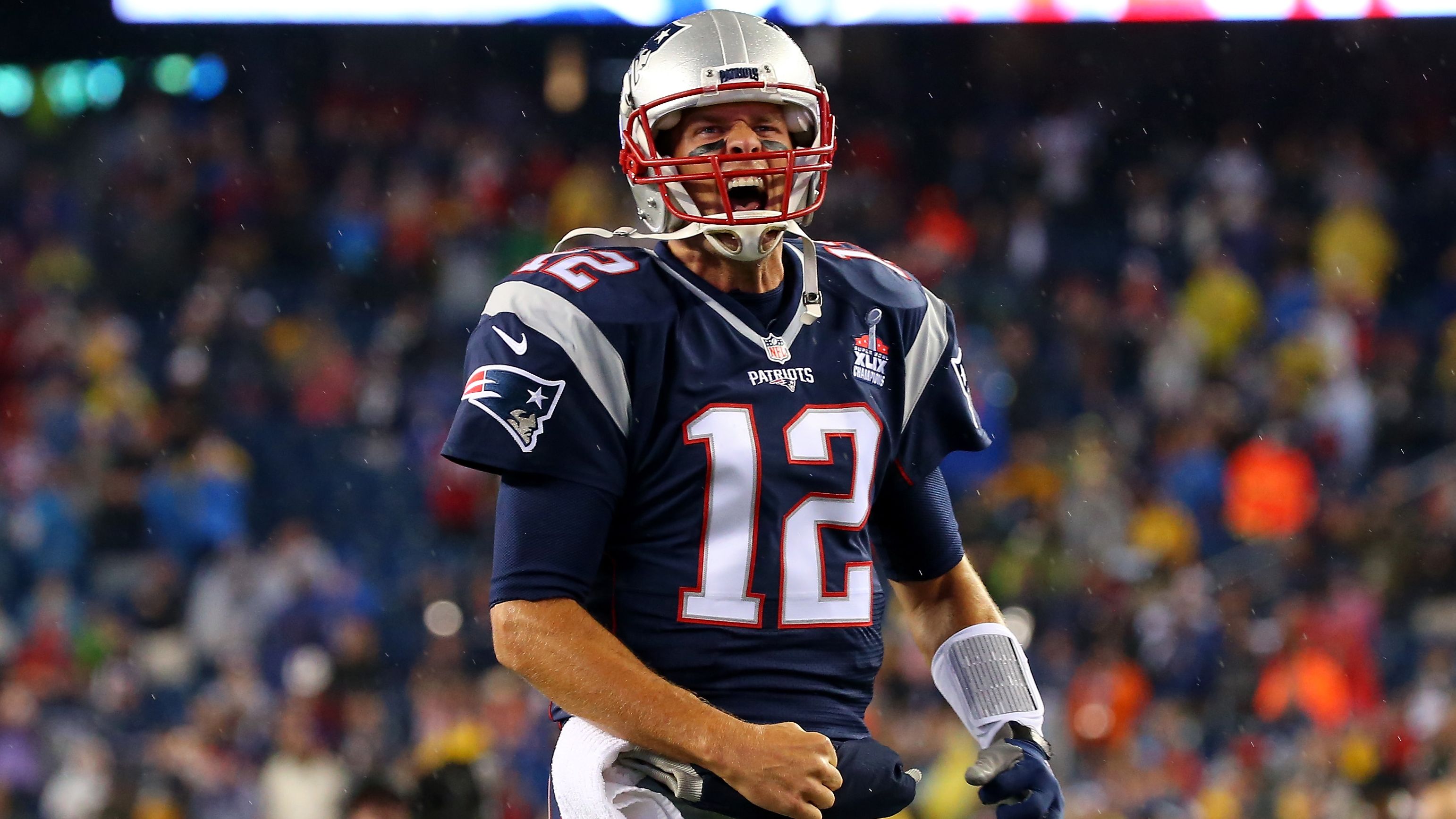 Brady runs onto the field before a game in September 2015.