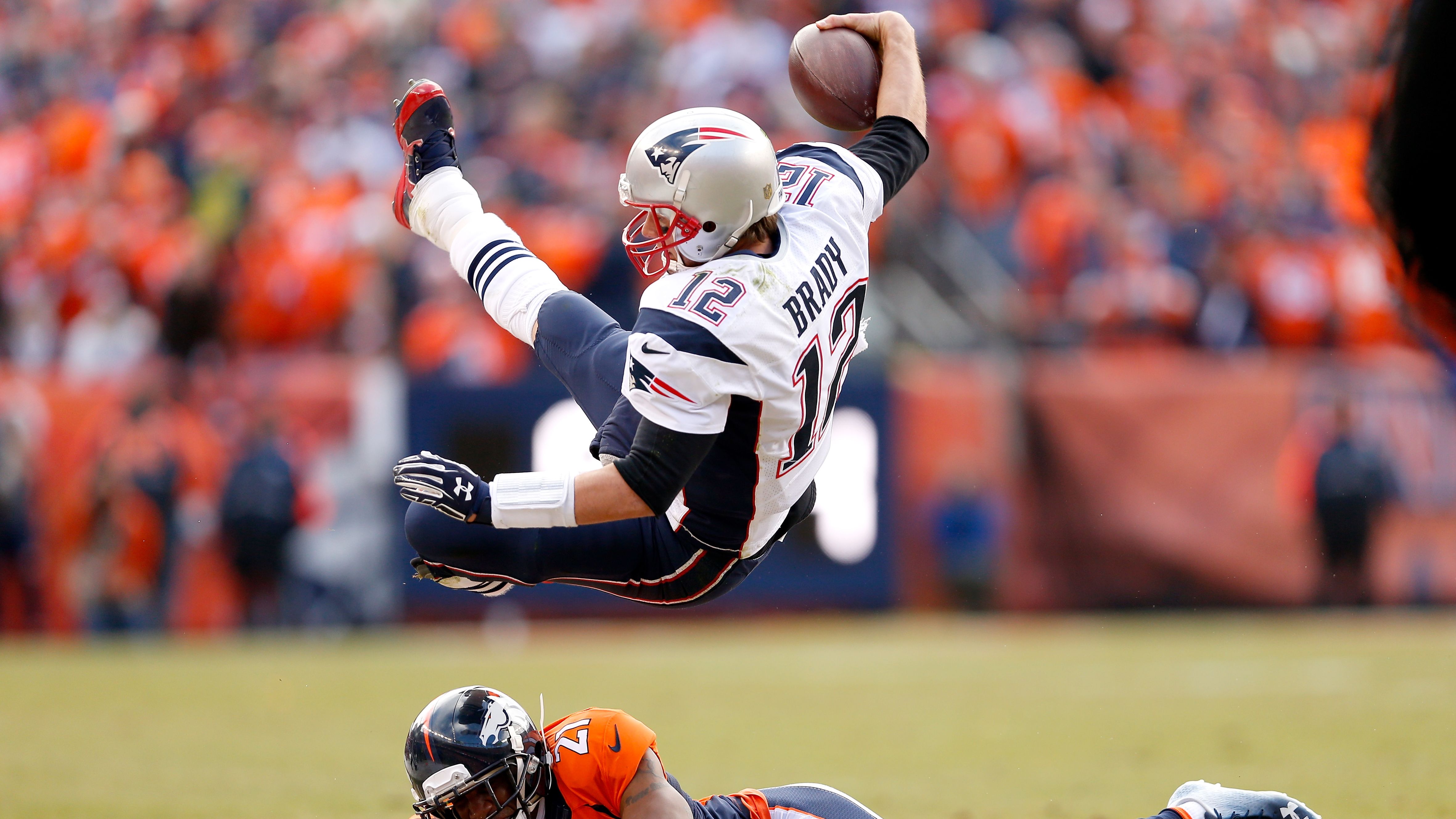 Brady is tackled by Denver's Aqib Talib in the AFC Championship game in January 2016.