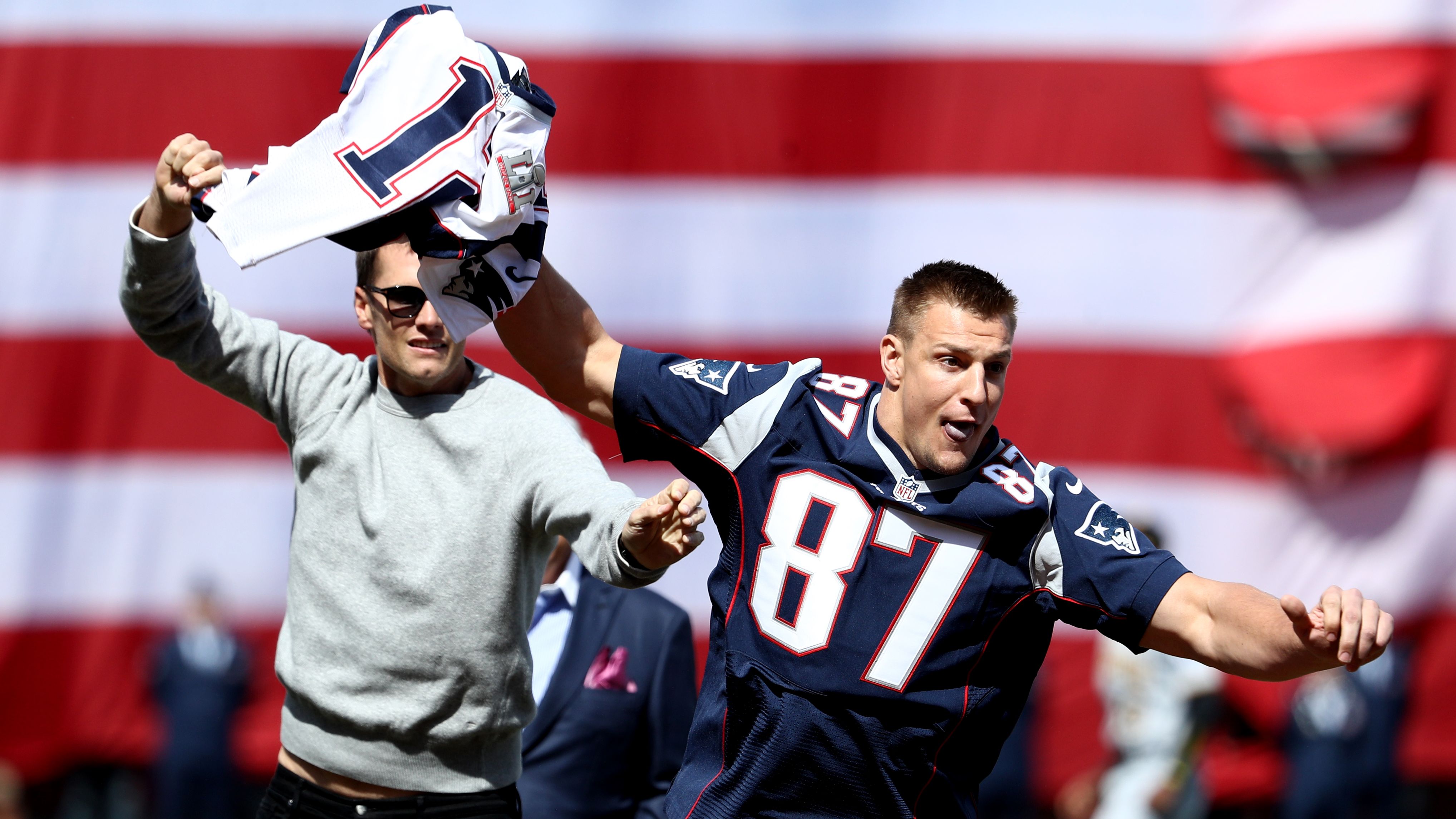 Teammate Rob Gronkowski playfully steals Brady's jersey before a Boston Red Sox baseball game in April 2017. Brady had just had his Super Bowl jersey returned by authorities after it had been stolen from the locker room.