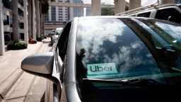 An Uber sticker is seen on a car windshield on the street in downtown Miami on January 9, 2020.