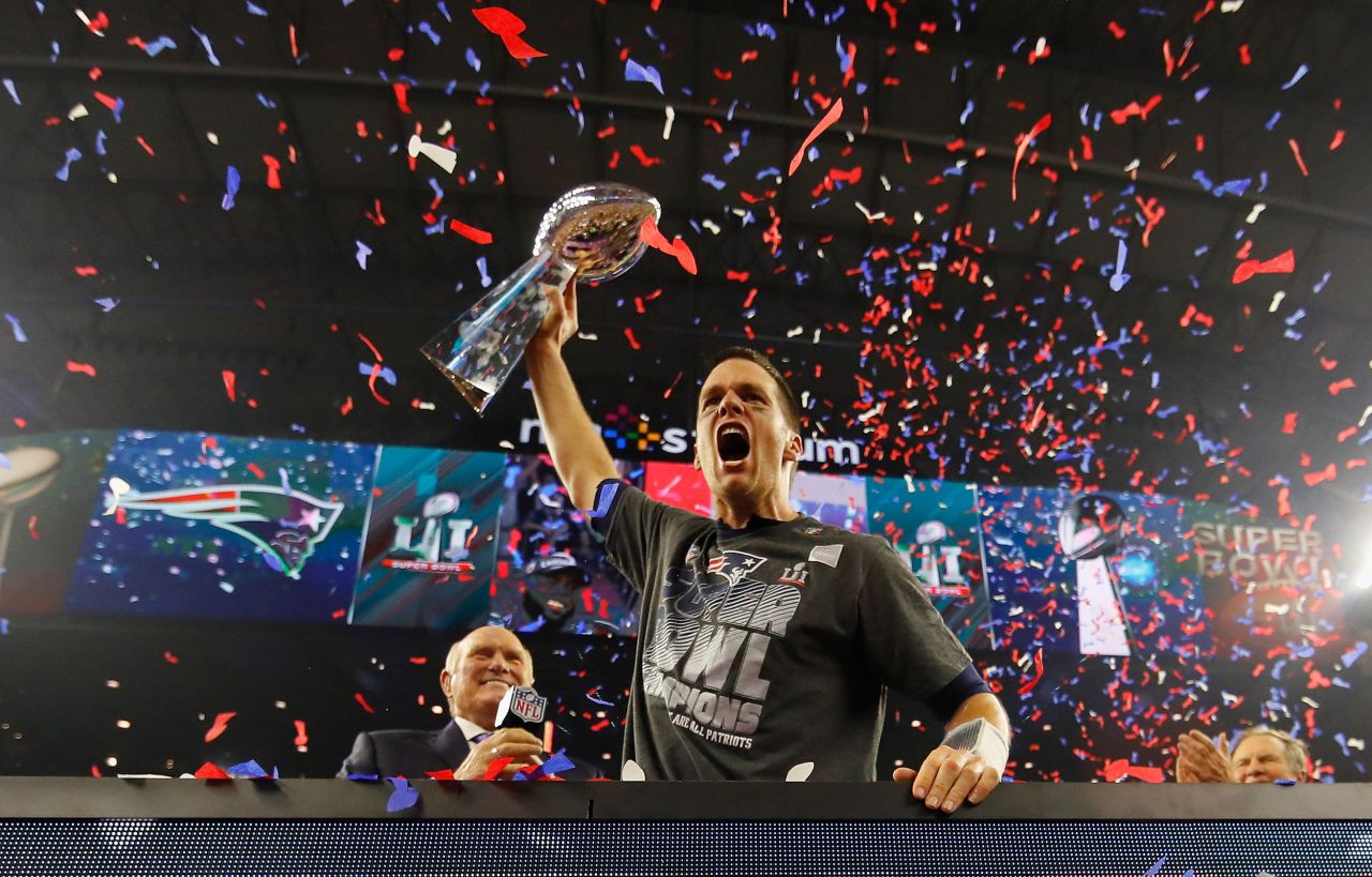 Brady raises the Vince Lombardi Trophy after leading the Patriots to their fifth Super Bowl victory in 2017. The Patriots were trailing 28-3 before pulling off the biggest Super Bowl comeback ever and winning in overtime.