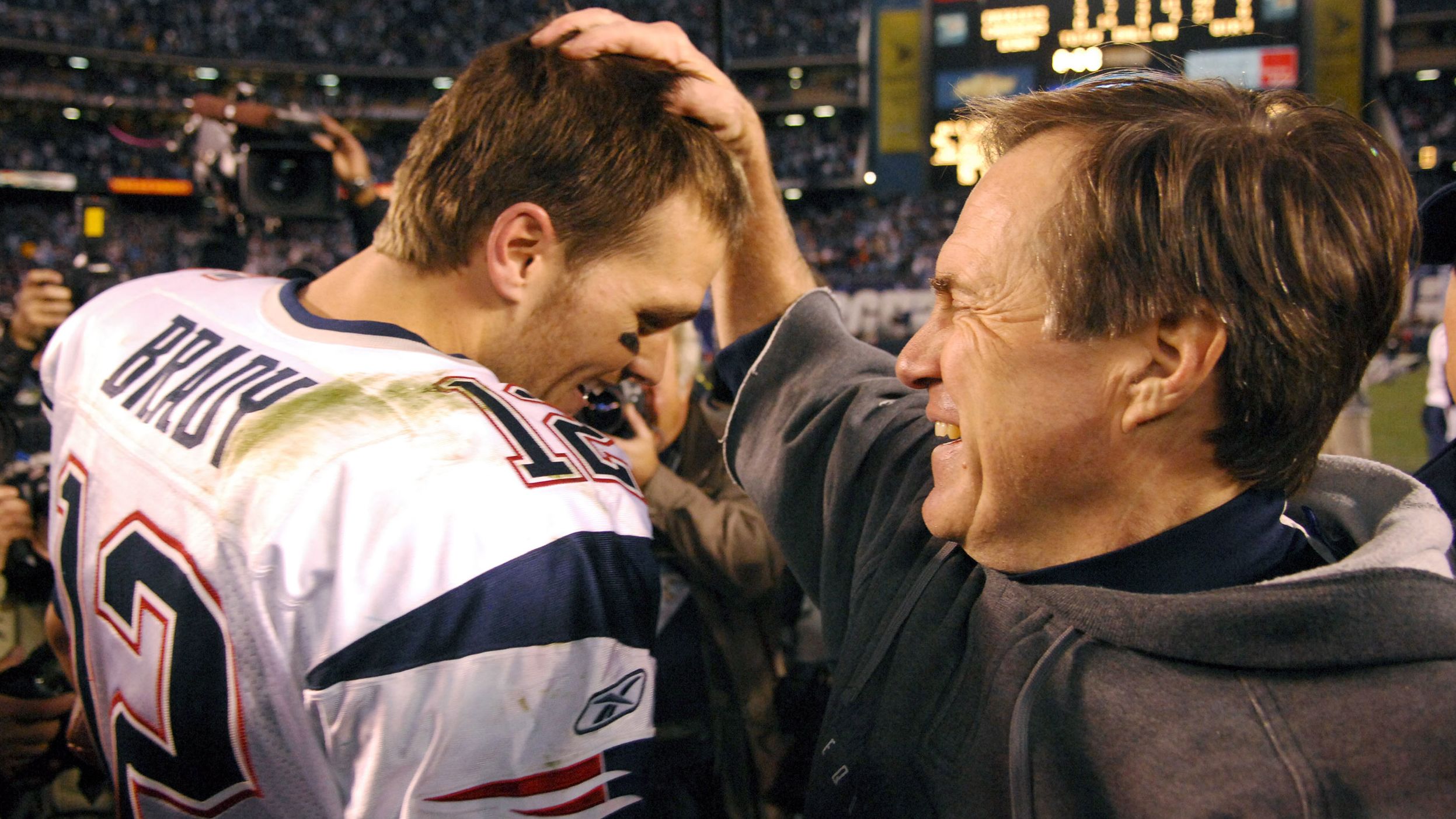 Brady and Patriots coach Bill Belichick celebrate after a playoff win in January 2007. The two were together for Brady's entire Patriots career.