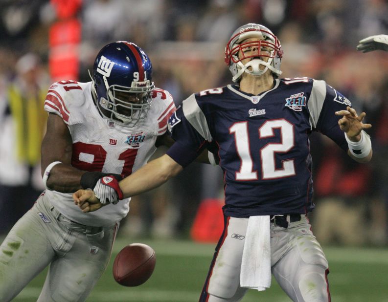 New York Giants defensive end Justin Tuck strips the ball from Brady during the Super Bowl in February 2008.