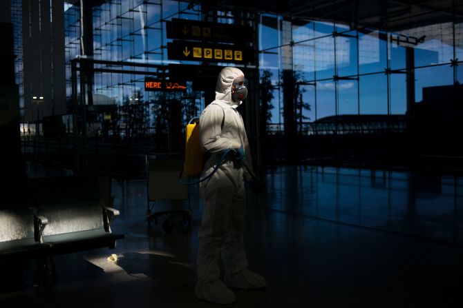 A member of Spain's Military Emergencies Unit carries out a general disinfection at the Malaga airport.