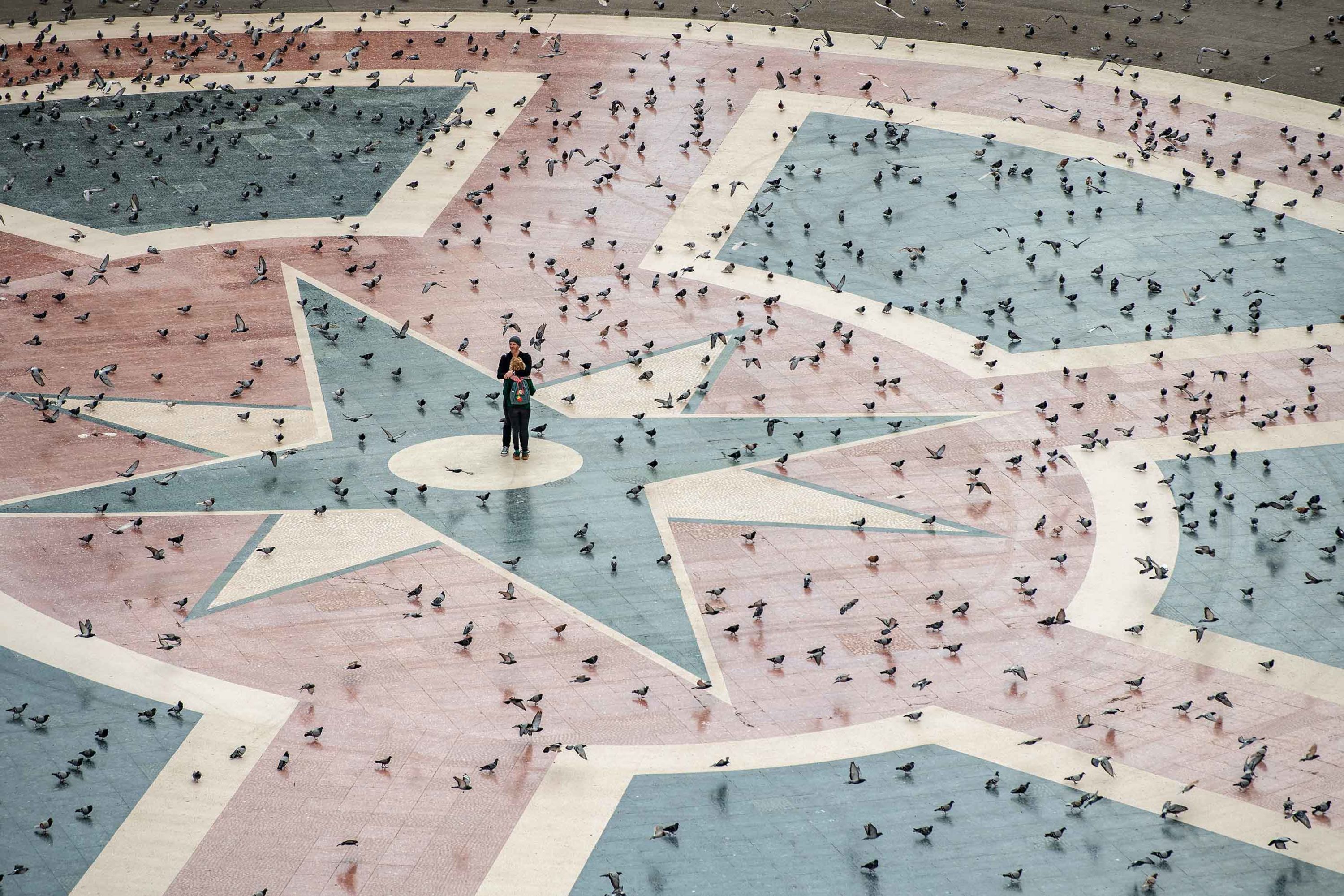 A couple in Barcelona, Spain, embraces in Catalunya Square on March 15.