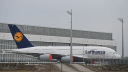 FREISING, GERMANY - MARCH 17: A Lufthansa Airbus A380 stands sidelined outside a hangar at Munich International Airport on March 17, 2020 in Freising, Germany. Lufthansa is temporarily grounding its fleet of A380s as well as smaller passenger jets in response to airport closures and a collapse in reservations due to the global coronavirus pandemic. Other airlines are not being spared either. (Photo by Andreas Gebert/Getty Images)