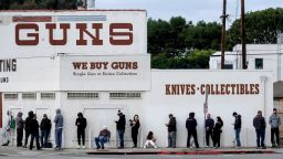 People wait in a line to enter a gun store in Culver City, Calif., Sunday, March 15, 2020. Coronavirus concerns have led to consumer panic buying of grocery staples and now gun stores are seeing a similar run on weapons and ammunition as panic intensifies. 
