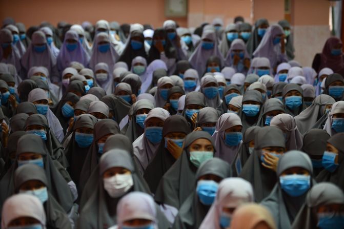 Students at the Attarkiah Islamic School wear face masks during a ceremony in Thailand's southern province of Narathiwat.