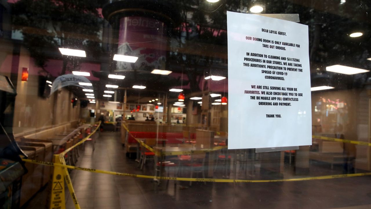 Stores and restaurants posted signs outside informing customers that they are closed.